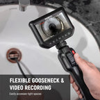 Person using a flexible gooseneck camera to inspect a drain.
